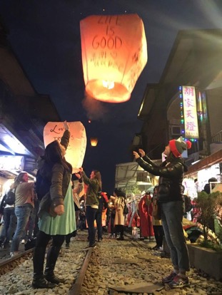 Letting go of our paper lantern during the Lantern Festival in Taiwan - thousands of lanterns were released that night in that area, and it’s beautiful to see the synchronized release of hundreds at a time 